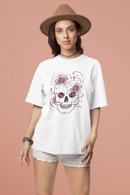 Second front view of female model wearing an off-white oversized t-shirt with a psychedelic skull flower design, perfect for a hippie, trance, or groovy style.