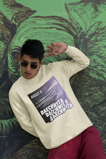 Fourth front view of a male model wearing a cream sweatshirt featuring a bold design inspired by BTS member Suga's alter ego, August D. Ideal for BTS fans (ARMY) and K-Pop enthusiasts who love rap music and artist individuality.