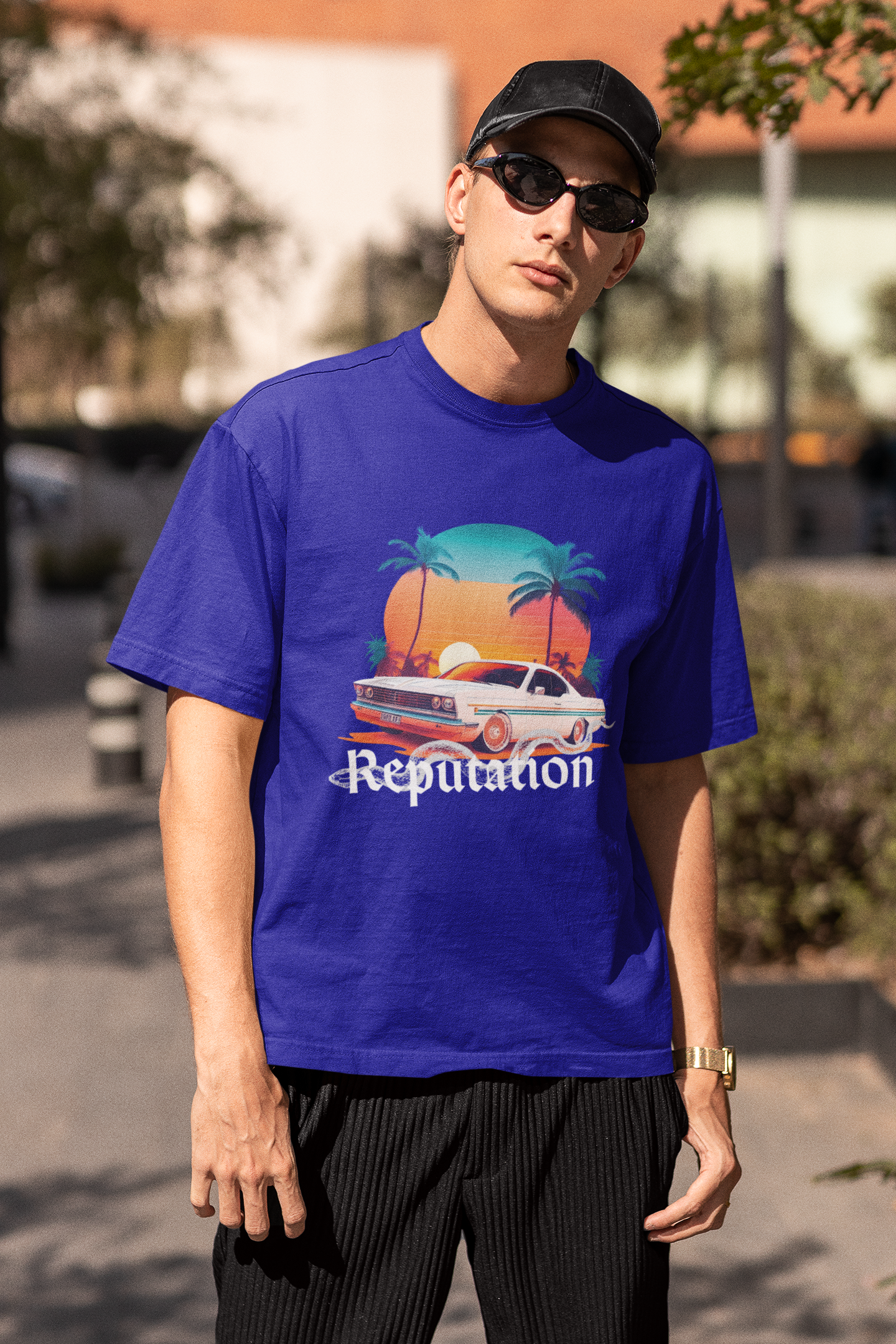 Third image of man wearing blue Oversize t-shirt featuring Reputation Taylor's Version design inspired by Taylor Swift's Reputation era