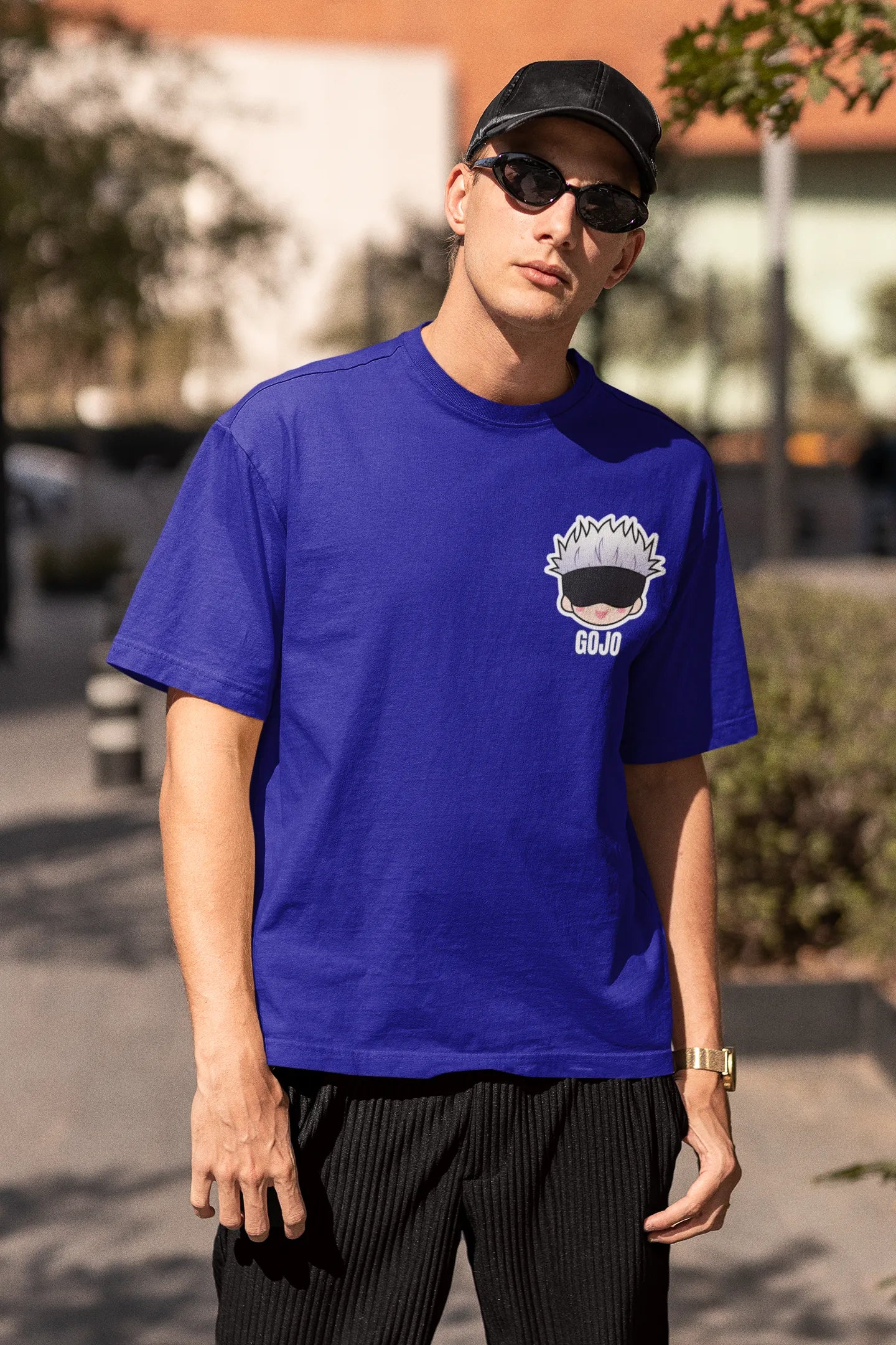 2nd front view of a male model wearing a royal blue oversized t-shirt featuring Gojo Satoru from Jujutsu Kaisen with the text "Satoru Gojo."