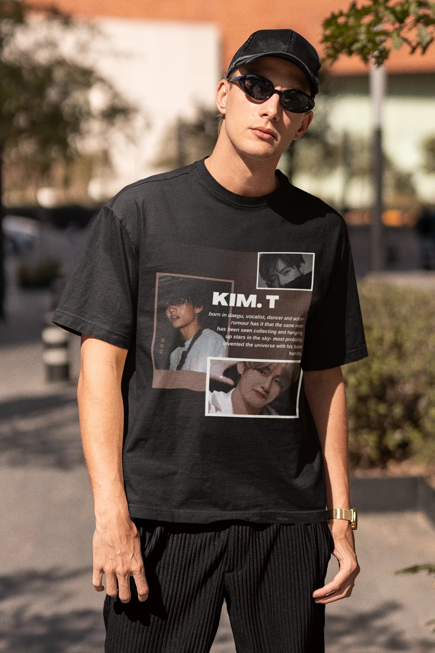 Third front view of male model wearing a black oversized t-shirt featuring a bold design inspired by BTS member Kim Taehyung (V). Ideal for BTS fans (ARMY) and K-Pop enthusiasts.