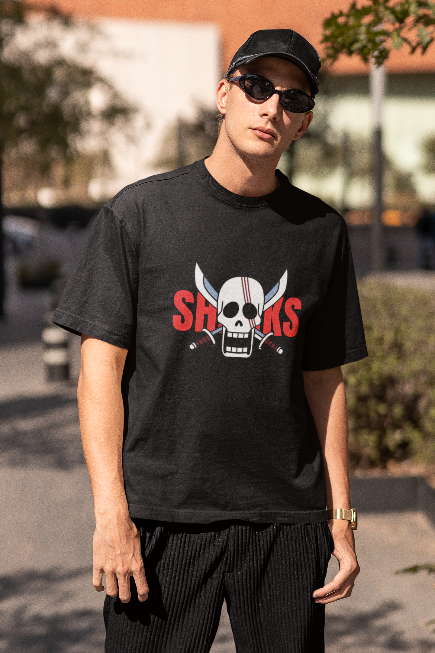 3rd front view of a male model wearing a black oversized t-shirt featuring Red-Haired Shanks from the One Piece anime.