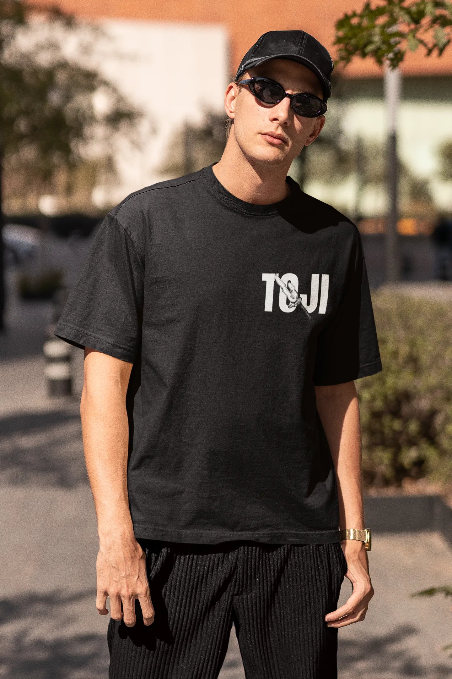 2nd front view of a male model wearing a black oversized t-shirt featuring Toji Fushiguro from the Jujutsu Kaisen anime.