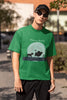 Third image of male model showcasing forest green oversized t-shirts inspired by Hakuna Matata from Disney's Lion King, featuring Pumbaa, Simba and other iconic characters.