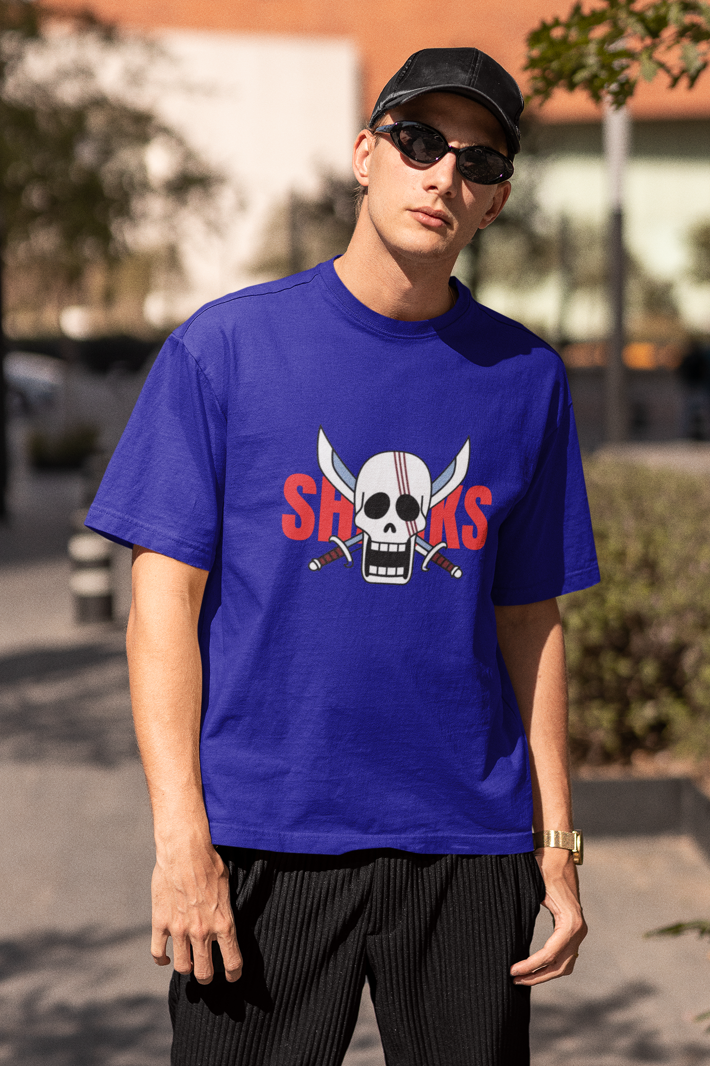 3rd front view of a male model wearing a royal blue oversized t-shirt featuring Red-Haired Shanks from the One Piece anime.