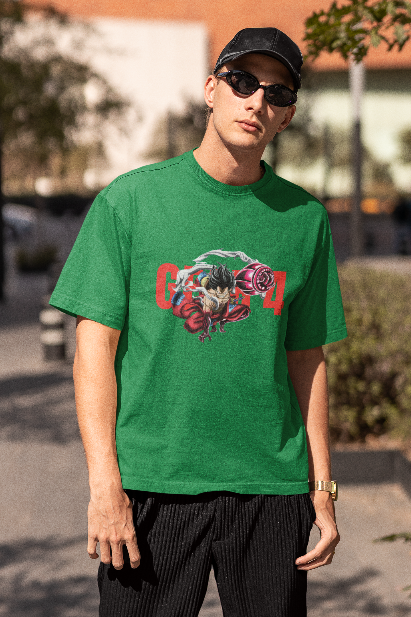 3rd front view of a male model wearing a forest green oversized t-shirt featuring Luffy in his Gear 4 Bounceman form from the One Piece anime.
