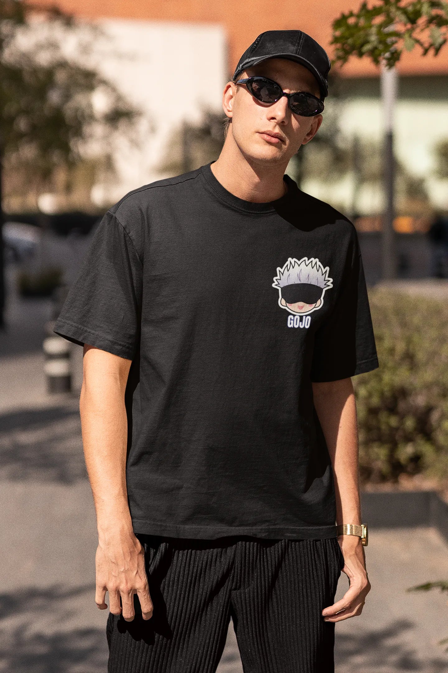 2nd front view of a male model wearing a black oversized t-shirt featuring Gojo Satoru from Jujutsu Kaisen with the text "Satoru Gojo."