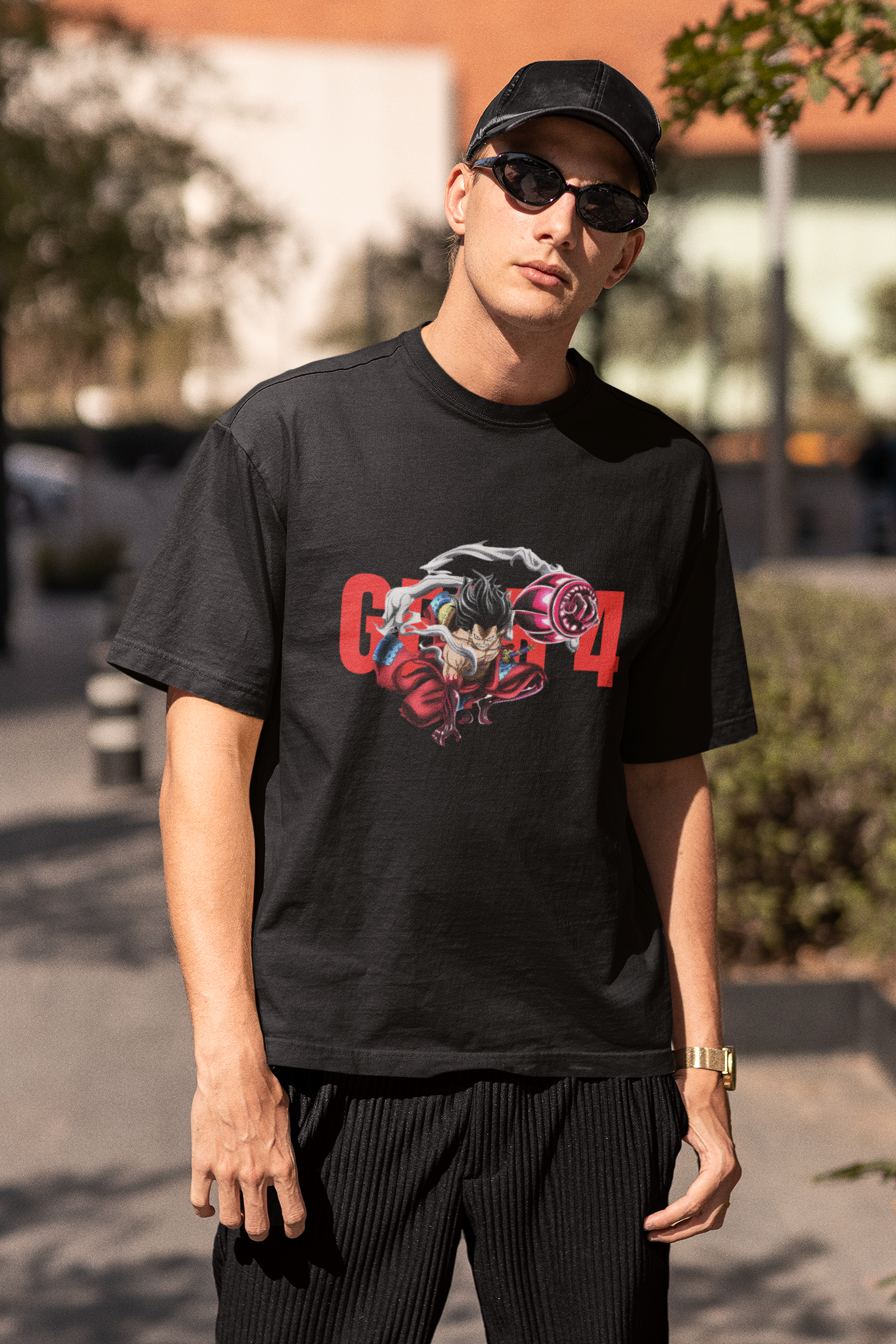 3rd front view of a male model wearing a black oversized t-shirt featuring Luffy in his Gear 4 Bounceman form from the One Piece anime.