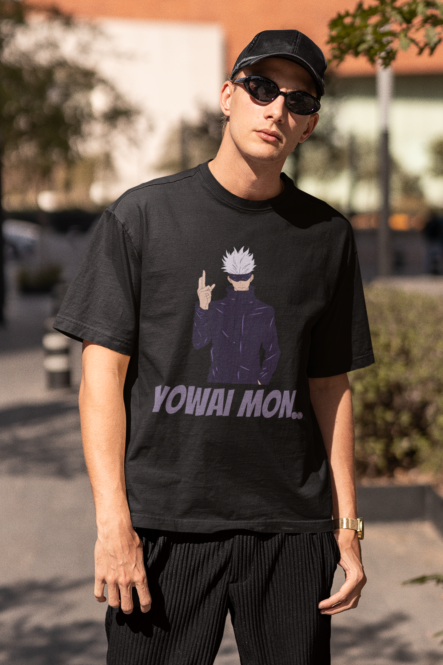 2nd front view of a male model wearing a black oversized t-shirt featuring Gojo Satoru with his fingers crossed and the text "Yowai Mon."