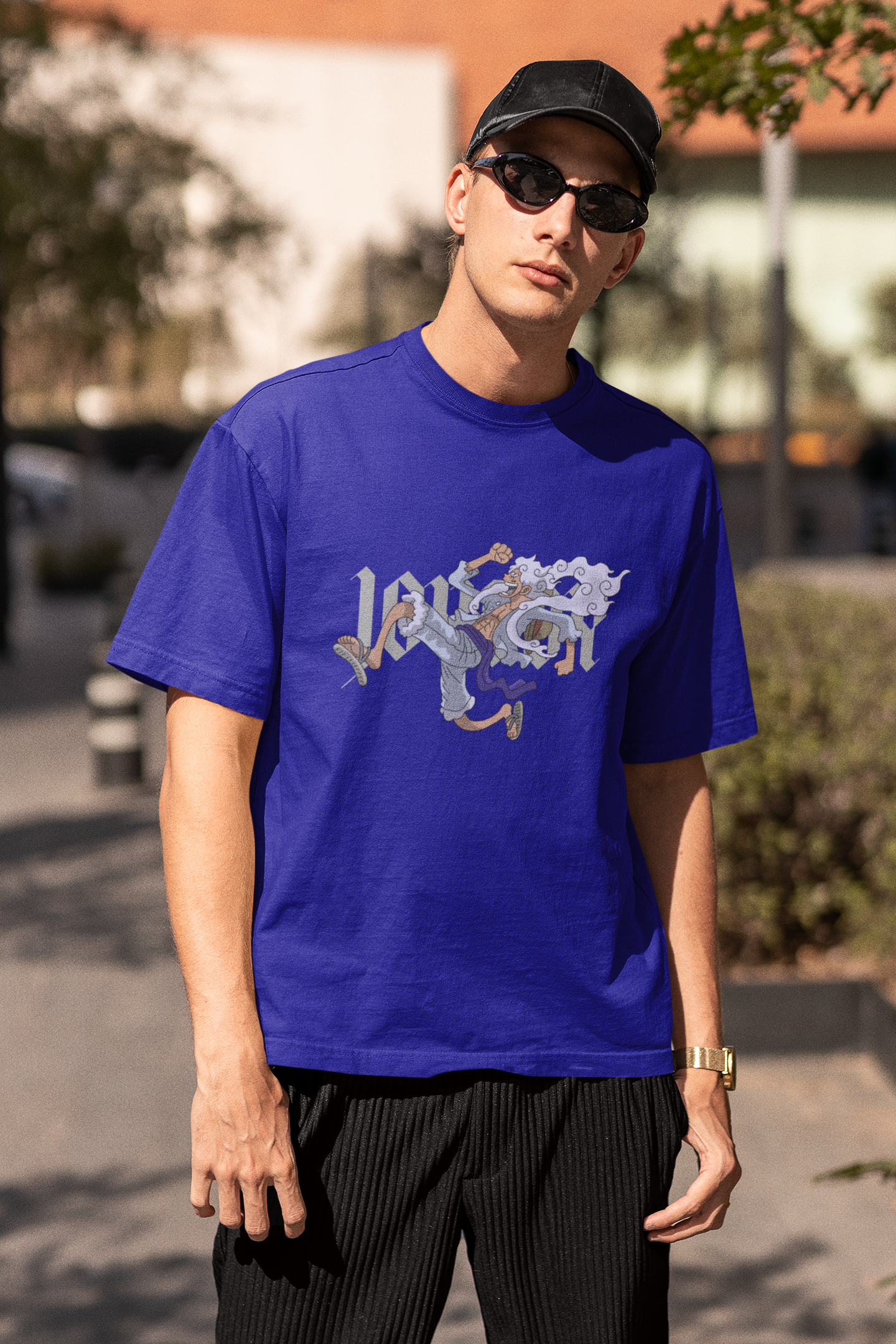 3rd front view of a male model wearing a royal blue oversized t-shirt featuring Luffy in his Gear 5 form from the One Piece anime.