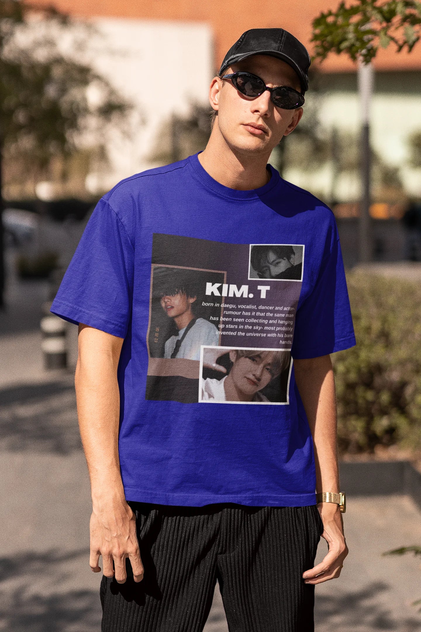 Third front view of male model wearing a royal blue oversized t-shirt featuring a bold design inspired by BTS member Kim Taehyung (V). Ideal for BTS fans (ARMY) and K-Pop enthusiasts.