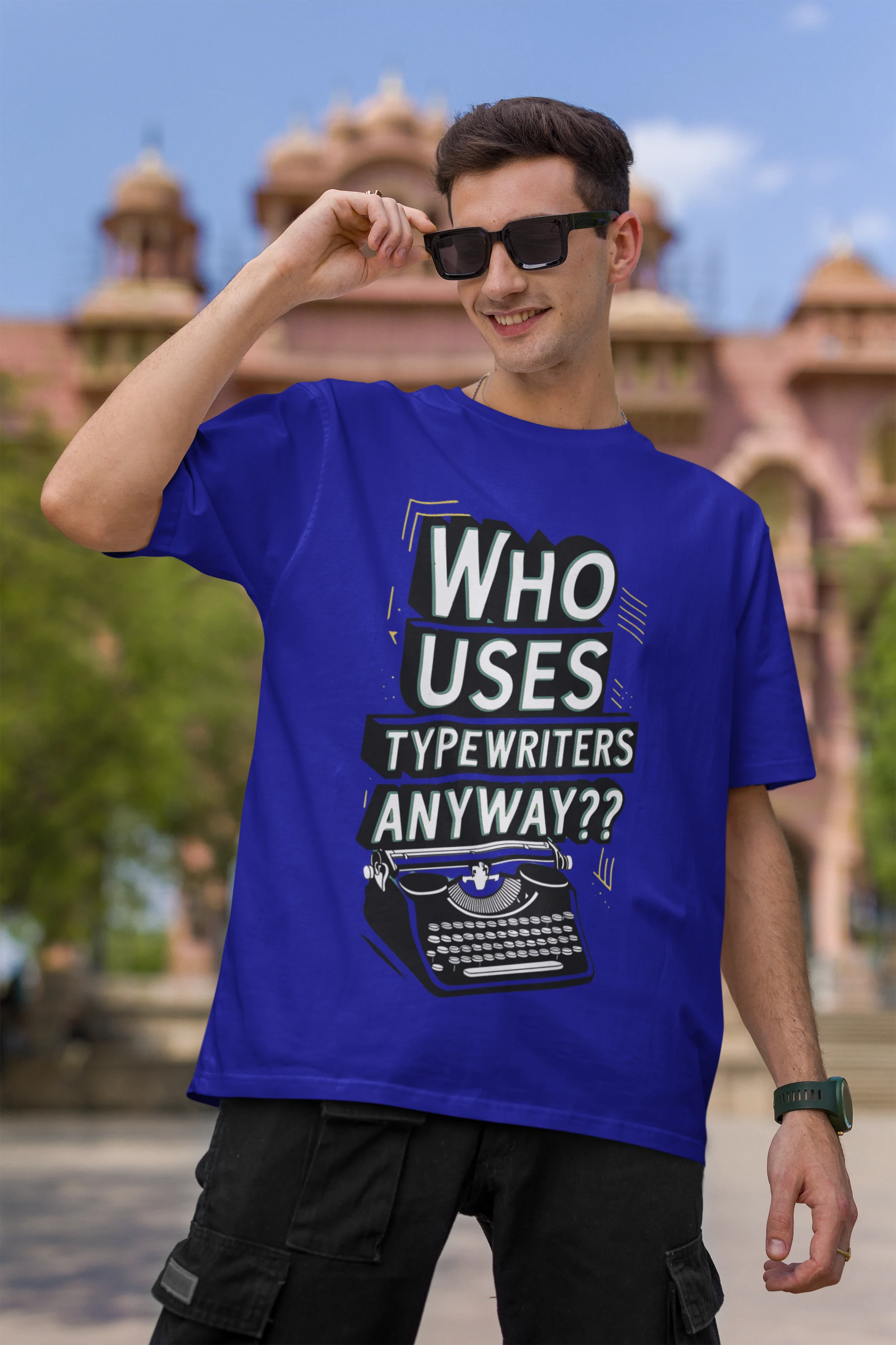 First Image of man wearing blue Oversize t-shirt featuring TTPD design inspired by Taylor Swift's Eras Tour.