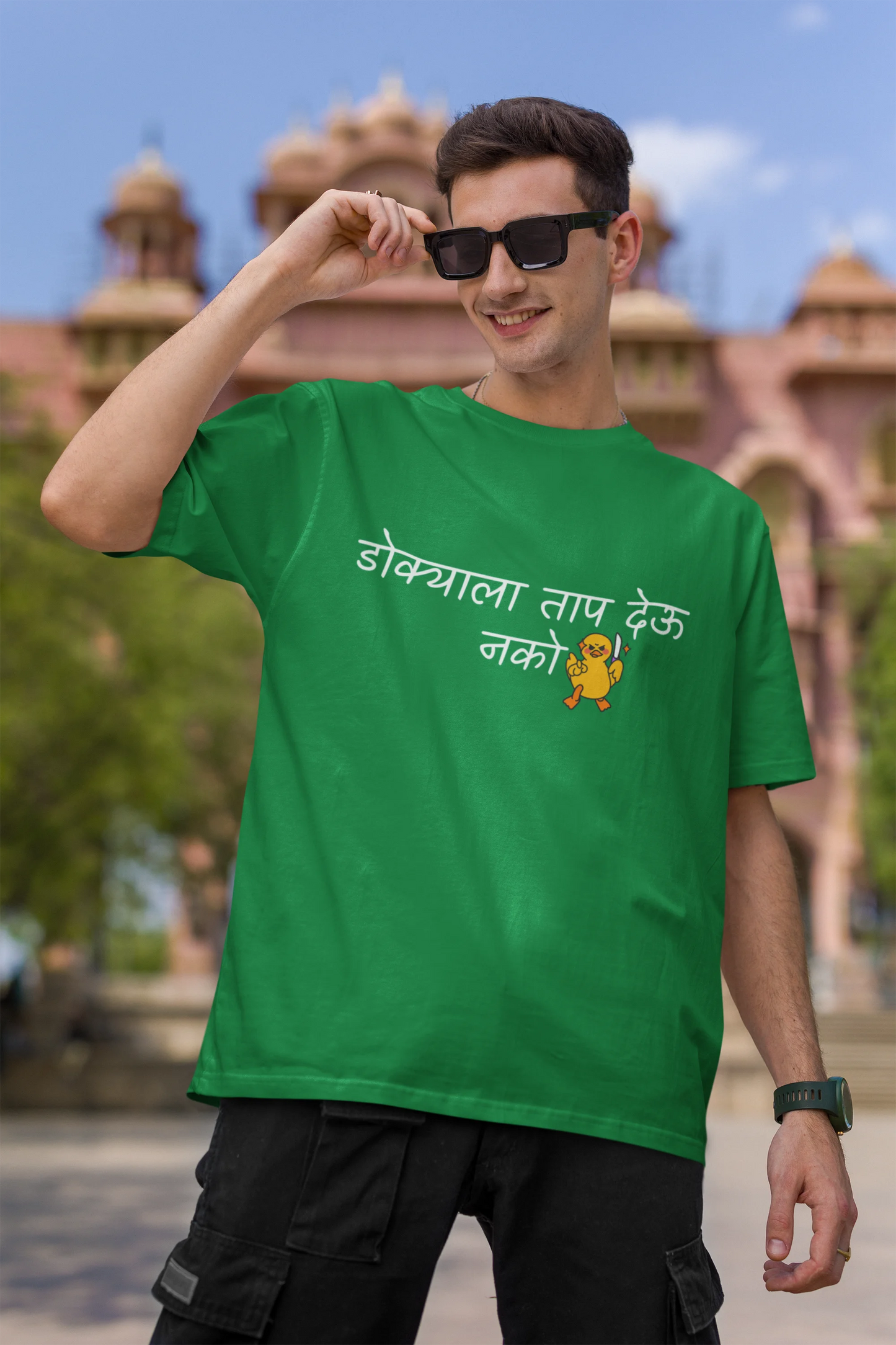 First front view of a male model wearing a forest green oversized t-shirt featuring a design inspired by Marathi culture. Perfect for anyone who loves Maharashtra and its vibrant traditions.