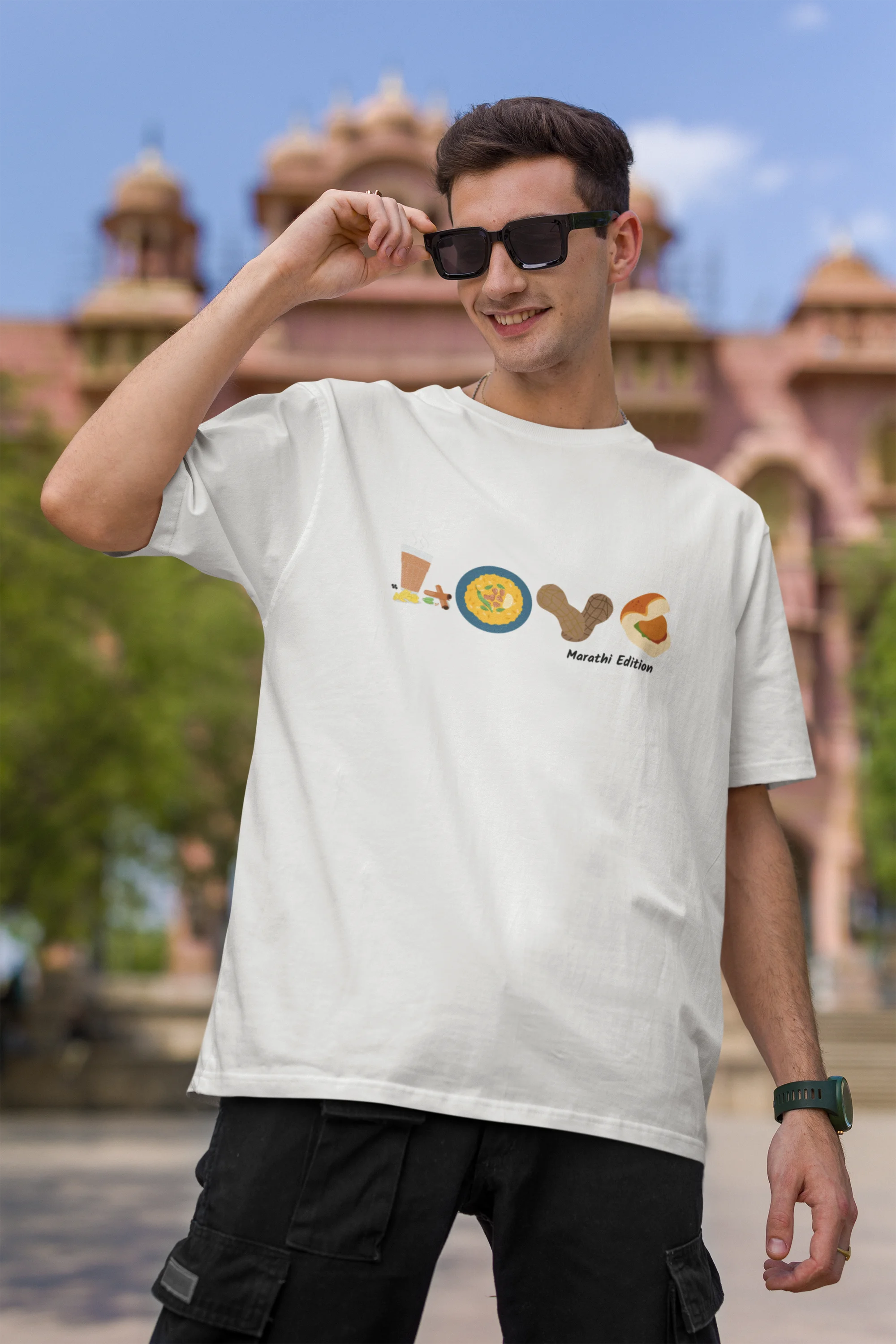 First front view of a male model wearing an off-white oversized t-shirt with a colorful design that celebrates Marathi culture. Ideal for anyone who loves Maharashtra and its vibrant heritage.