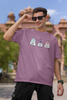 First image of male model wearing Disney-themed dirty purple oversized tee with a cute cartoon design