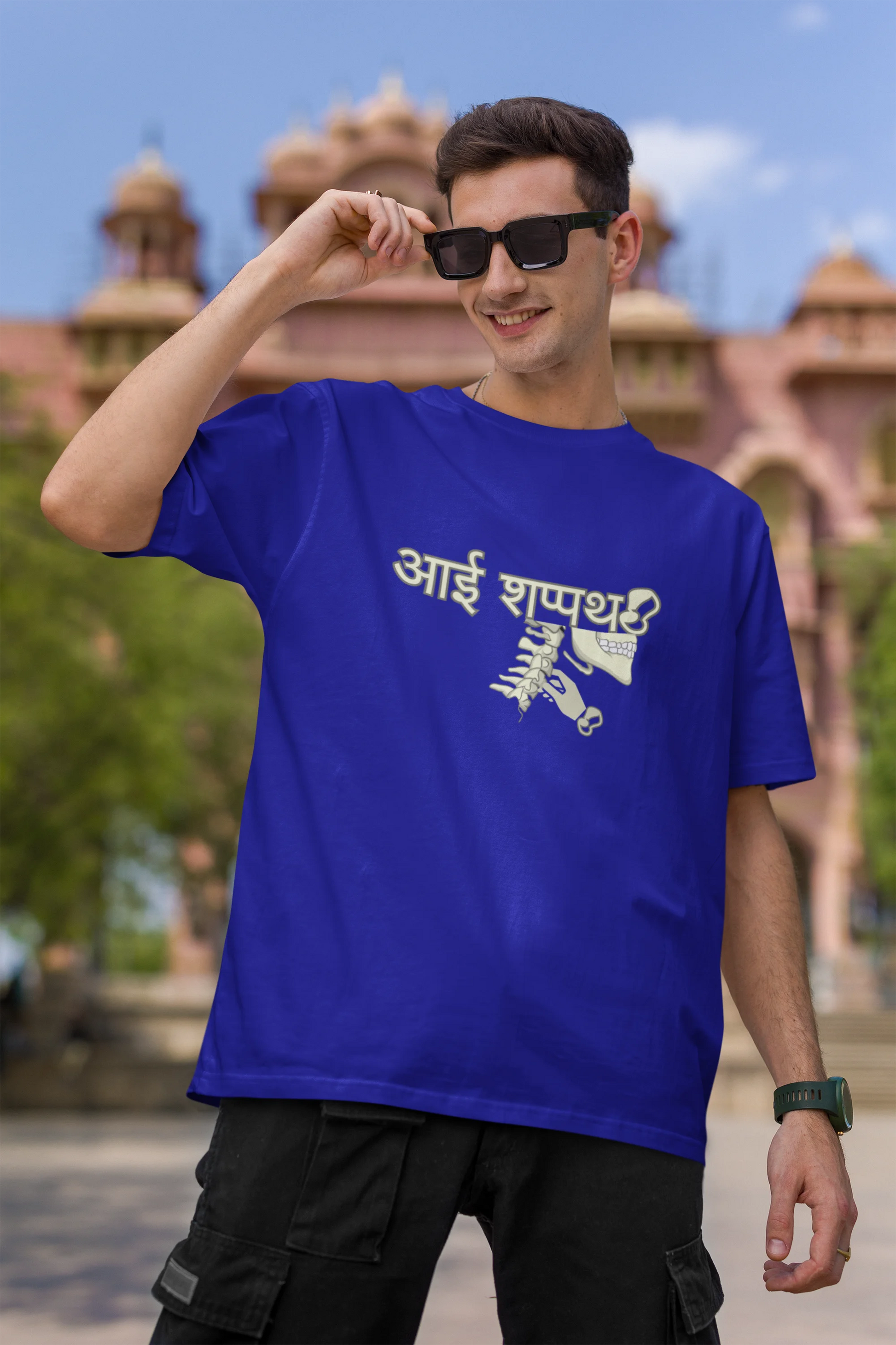 First front view of male model wearing a royal blue oversized t-shirt featuring a design inspired by the Marathi saying "Aai Sapath." Perfect for fans of Marathi culture and anyone who wants to celebrate their heritage.