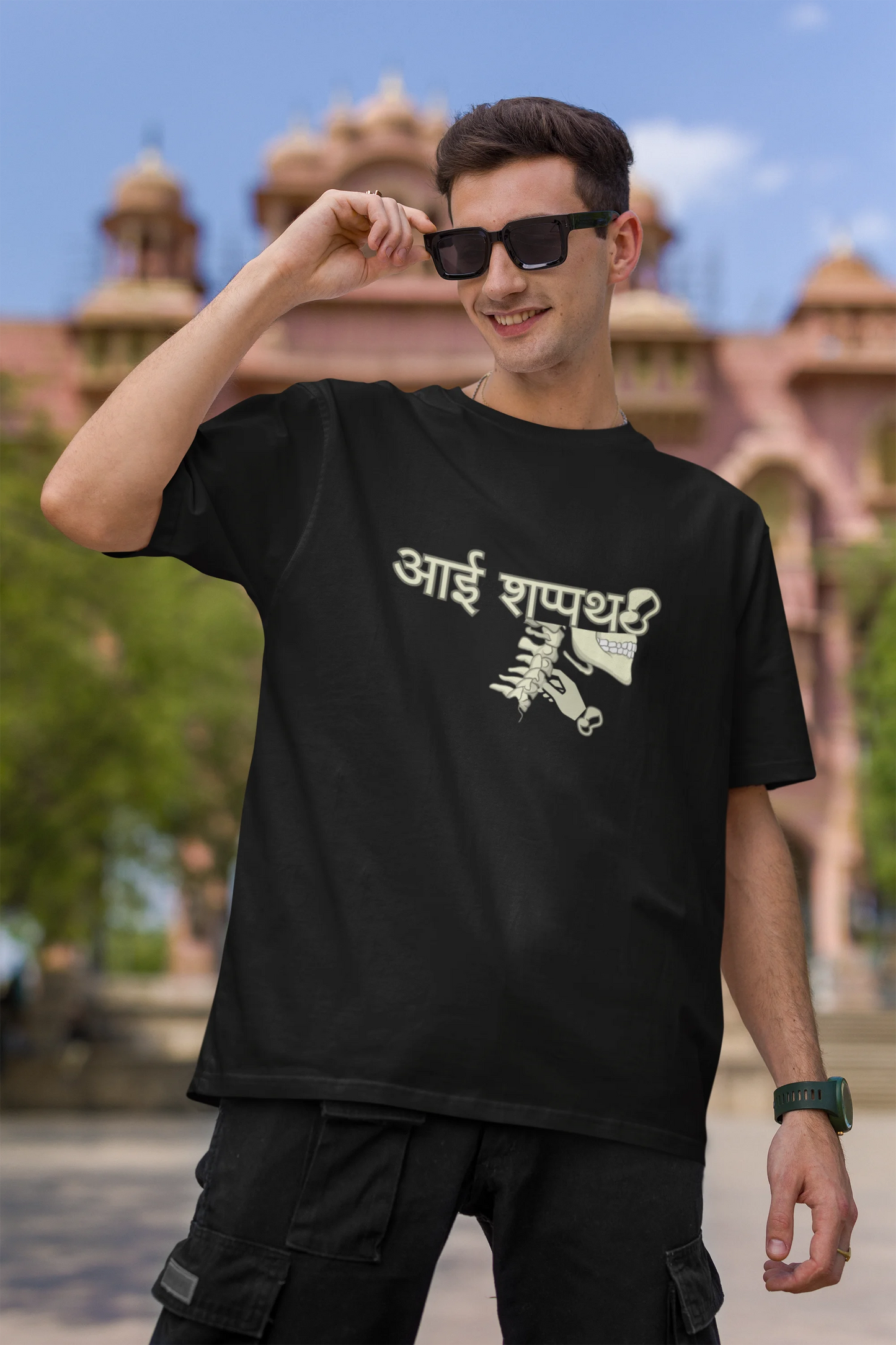 First front view of male model wearing a black oversized t-shirt featuring a design inspired by the Marathi saying "Aai Sapath." Perfect for fans of Marathi culture and anyone who wants to celebrate their heritage.
