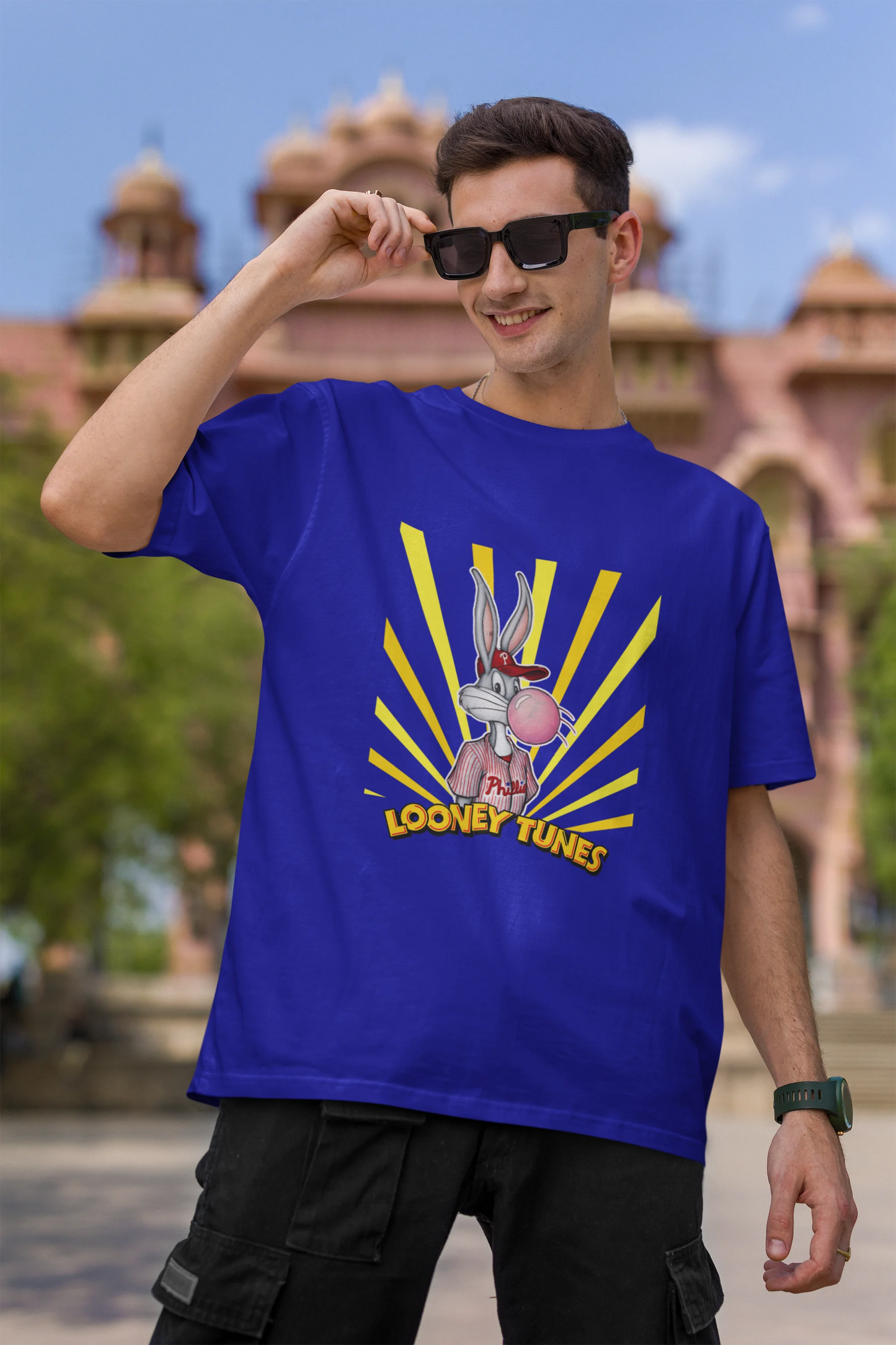First image of male Model showcasing blue Bugs Bunny oversize t-shirt from Looney Tunes, featuring a bold Bugs Bunny design
