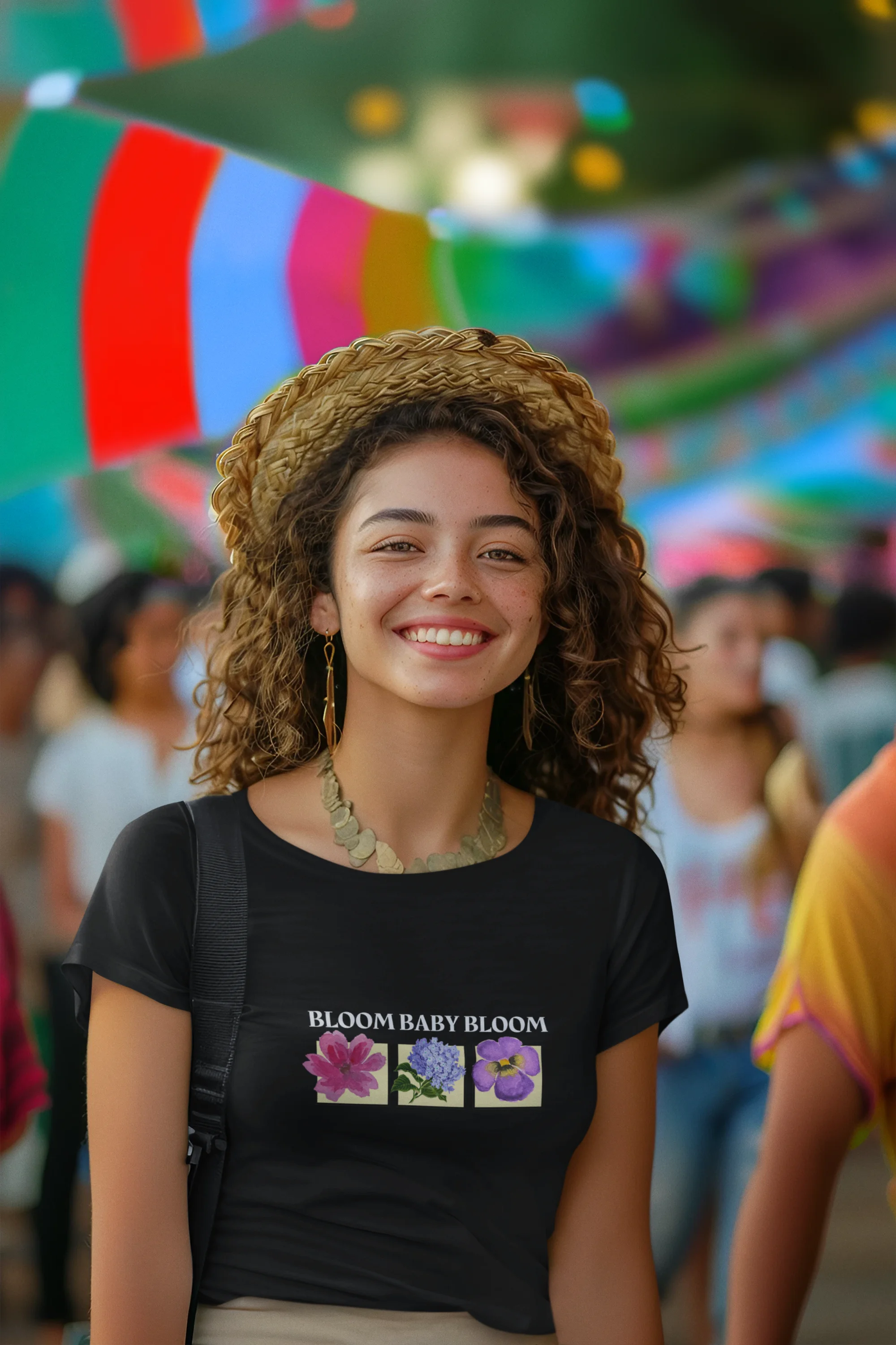 Second front view of a female model wearing a black crop top with a floral "bloom baby bloom" design, exuding a cool and confident vibe.