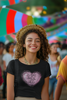 Second front view of a female model wearing a black crop top with a heart-shaped 