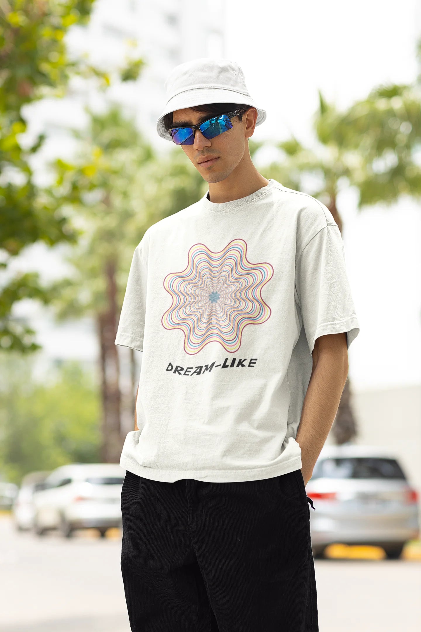 Right side view of male model wearing an off-white Oversized t-shirt with a dreamlike spiderweb design made of frequencies, offering a visually captivating and relaxing aesthetic.