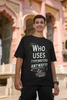 Second Image of man wearing black Oversize t-shirt featuring TTPD design inspired by Taylor Swift's Eras Tour.