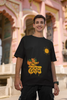 Third front view of male model wearing an black oversized t-shirt featuring a design inspired by the Marathi word 