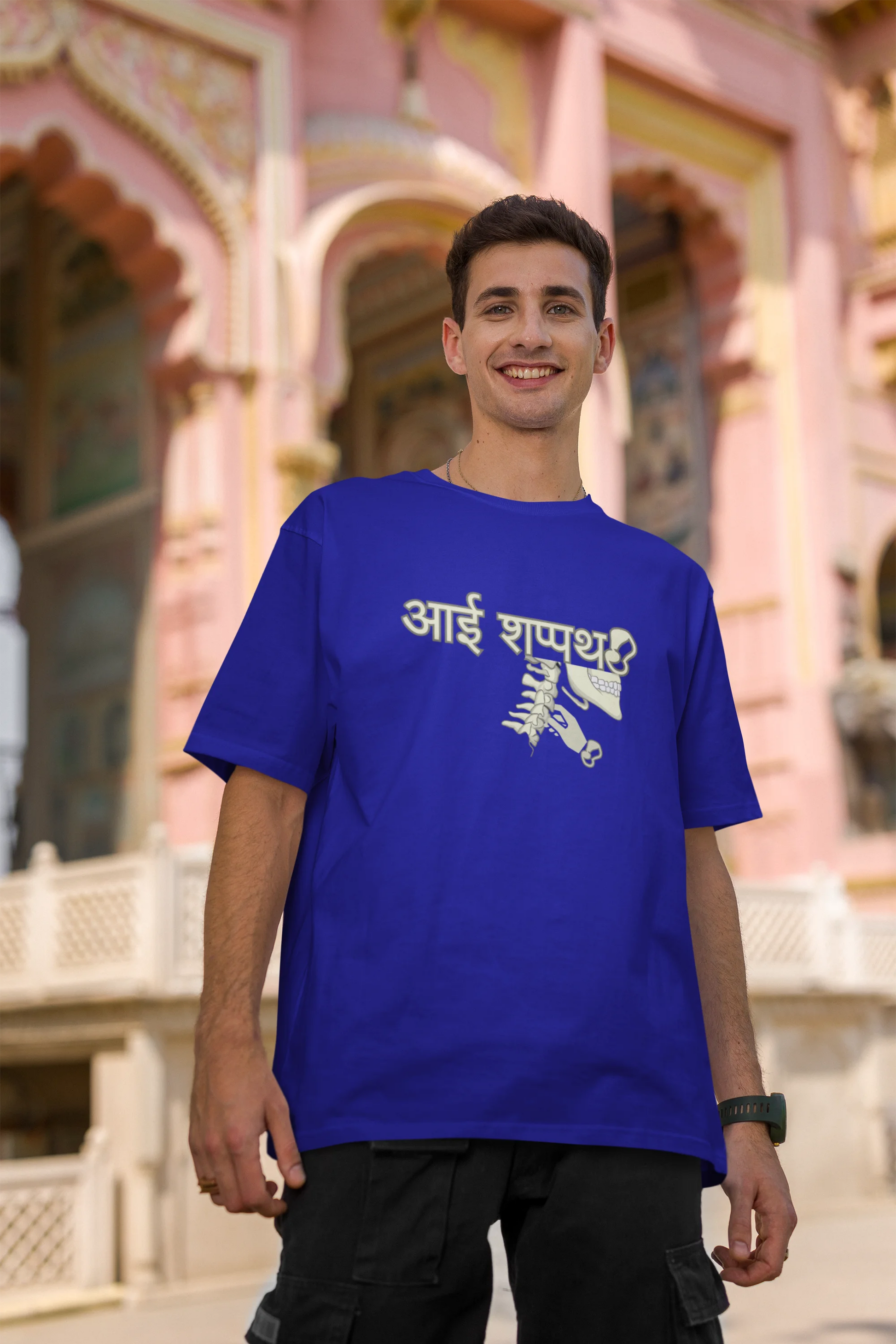 Second front view of male model wearing a royal blue oversized t-shirt featuring a design inspired by the Marathi saying "Aai Sapath." Perfect for fans of Marathi culture and anyone who wants to celebrate their heritage.