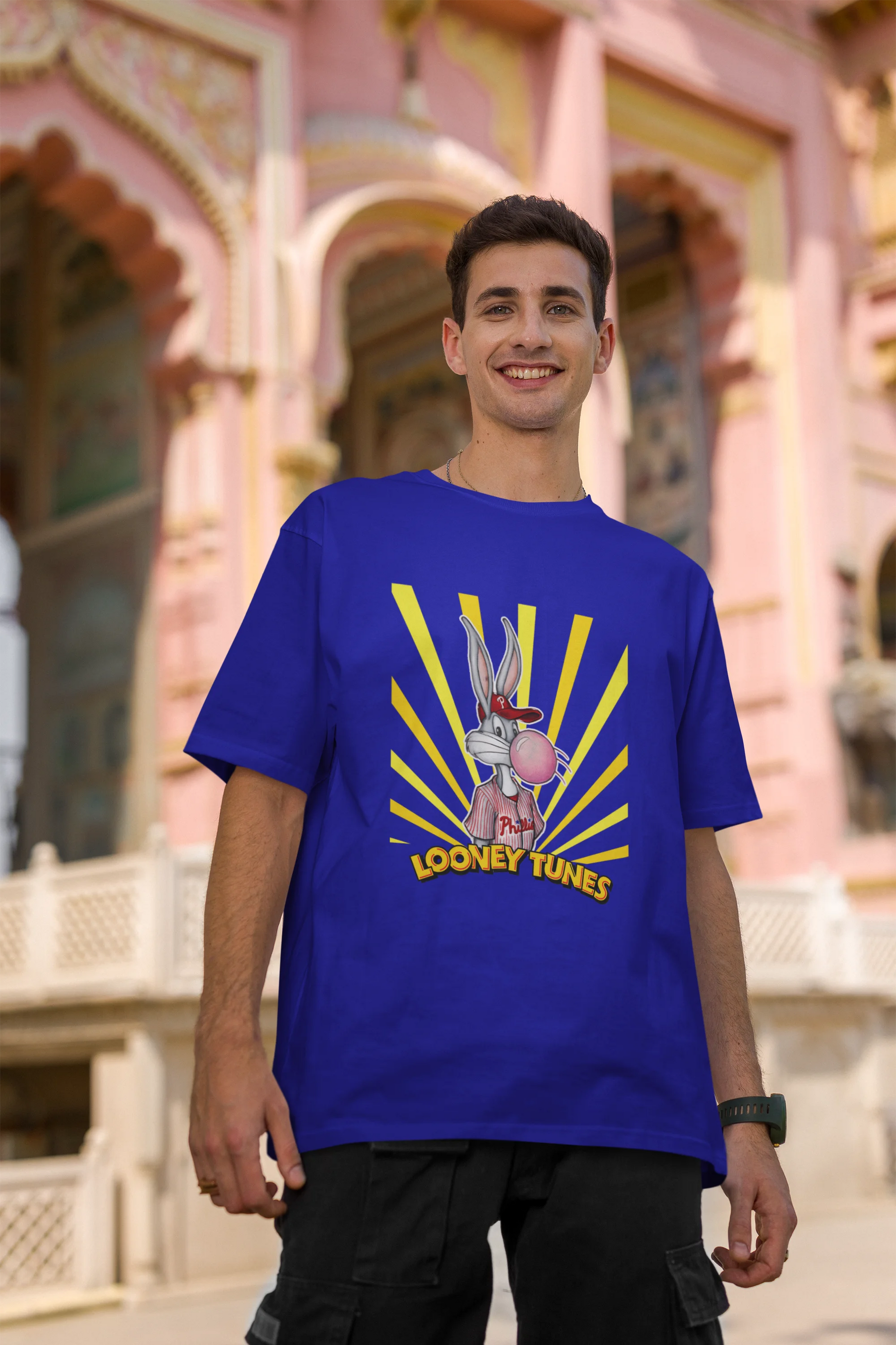 Second image of male Model showcasing blue Bugs Bunny oversize t-shirt from Looney Tunes, featuring a bold Bugs Bunny design